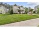 Charming home with a well-manicured lawn, lush landscaping, a covered porch, and a welcoming entryway at 925 Hidden Jewel Ln, Wake Forest, NC 27587