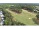 Lush green golf course featuring sand traps, mature trees and well-manicured fairways at 925 Hidden Jewel Ln, Wake Forest, NC 27587