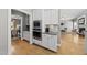 Modern kitchen with stainless steel appliances, granite countertops, and custom white cabinets at 925 Hidden Jewel Ln, Wake Forest, NC 27587