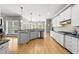 Expansive kitchen with granite countertops, stainless steel appliances, and backyard view at 925 Hidden Jewel Ln, Wake Forest, NC 27587