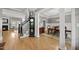 Open concept living with staircase and a fireplace as seen from a hardwood floor entry at 925 Hidden Jewel Ln, Wake Forest, NC 27587