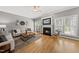 Inviting living room with a fireplace, comfortable seating, and abundant natural light at 925 Hidden Jewel Ln, Wake Forest, NC 27587