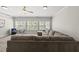 Spacious living room featuring a comfortable sectional sofa, carpet floors, and natural light at 925 Hidden Jewel Ln, Wake Forest, NC 27587