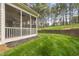 Comfortable screened porch with ceiling fans, offering a tranquil view of the yard at 925 Hidden Jewel Ln, Wake Forest, NC 27587
