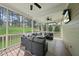 Relaxing screened porch with comfortable seating and scenic backyard views at 925 Hidden Jewel Ln, Wake Forest, NC 27587