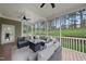 Inviting screened porch featuring stylish furniture and ample seating for guests at 925 Hidden Jewel Ln, Wake Forest, NC 27587