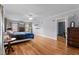 Spacious bedroom featuring hardwood floors, neutral walls and a ceiling fan at 925 S Chestnut St, Henderson, NC 27536