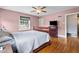 Bedroom with a pink wall and a sleigh bed at 925 S Chestnut St, Henderson, NC 27536