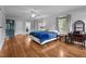 Bedroom featuring hardwood floors, a ceiling fan and natural light at 925 S Chestnut St, Henderson, NC 27536