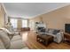 Bright living room featuring hardwood floors, white trim and natural light at 925 S Chestnut St, Henderson, NC 27536