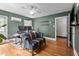 Office with dark green painted walls, hardwood floor, and dual monitors at 925 S Chestnut St, Henderson, NC 27536