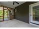 A cozy back porch featuring a screened entry and a ceiling fan for relaxing outdoor comfort at 96 Linda Lou Ln, Angier, NC 27501