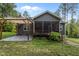Back of house featuring a screened porch, brick patio with pergola and an outdoor planter at 96 Linda Lou Ln, Angier, NC 27501