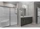 Bathroom features a tiled walk-in shower with a glass door and sleek fixtures at 96 Linda Lou Ln, Angier, NC 27501