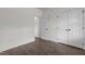 Clean bedroom with hardwood floors, white walls, and a closet with double doors at 96 Linda Lou Ln, Angier, NC 27501