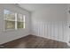Well lit bedroom with hardwood floors, bright walls, and modern wainscotting feature at 96 Linda Lou Ln, Angier, NC 27501