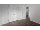 Spacious bedroom features hardwood floors and a closet with a modern style paneled doors at 96 Linda Lou Ln, Angier, NC 27501