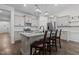Charming kitchen with granite countertops, stainless steel appliances, and a breakfast bar at 96 Linda Lou Ln, Angier, NC 27501