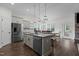 Kitchen with stainless steel appliances, granite countertops, and a dining area at 96 Linda Lou Ln, Angier, NC 27501