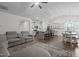 Open concept kitchen and living room area, featuring modern stainless steel appliances and pendant lighting at 96 Linda Lou Ln, Angier, NC 27501