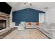 Comfortable living room features a stone fireplace, vaulted ceiling, and a large sectional sofa at 96 Linda Lou Ln, Angier, NC 27501