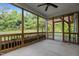 Enjoy outdoor living with this screened porch and wooded views at 96 Linda Lou Ln, Angier, NC 27501