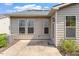 Inviting back patio with a door and many windows, perfect for relaxation and entertaining at 1008 Sounding Ln, Durham, NC 27703