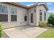 Cozy back patio with multiple windows and an access door for outdoor enjoyment at 1008 Sounding Ln, Durham, NC 27703