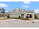 Creekside clubhouse with welcoming entrance, manicured landscaping, and ample parking at 1008 Sounding Ln, Durham, NC 27703