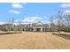 Community clubhouse with manicured lawn, covered entrance, and convenient bike racks at 1008 Sounding Ln, Durham, NC 27703