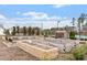 Community garden plots with wooden planters and a storage shed at 1008 Sounding Ln, Durham, NC 27703
