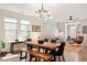 Open concept dining room with hardwood floors and a modern light fixture at 1008 Sounding Ln, Durham, NC 27703