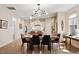 Open concept dining room leads into bright modern kitchen with a center island at 1008 Sounding Ln, Durham, NC 27703