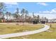 Community dog park featuring secure fencing, seating, and green space at 1008 Sounding Ln, Durham, NC 27703