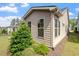 Well maintained home exterior with green landscaping and beautiful architectural details at 1008 Sounding Ln, Durham, NC 27703