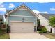 Charming home with a spacious garage and a beautifully landscaped front yard, providing curb appeal at 1008 Sounding Ln, Durham, NC 27703