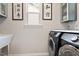 Well-equipped laundry room with modern appliances and ample counter space at 1008 Sounding Ln, Durham, NC 27703
