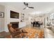Inviting living room with fireplace opens into dining room and modern kitchen at 1008 Sounding Ln, Durham, NC 27703