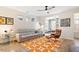 Comfortable living room featuring hardwood floors, a modern sofa, and plenty of natural light at 1008 Sounding Ln, Durham, NC 27703
