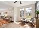 Bright living room features hardwood floors and natural light from the large windows at 1008 Sounding Ln, Durham, NC 27703
