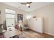 Home office with a murphy bed, hardwood floors, and a large window at 1008 Sounding Ln, Durham, NC 27703
