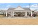 Outdoor kitchen with seating and stone accents in community recreation area at 1008 Sounding Ln, Durham, NC 27703