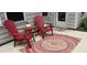 Inviting patio arrangement with stylish chairs and a colorful rug, enhancing the outdoor living experience at 1008 Sounding Ln, Durham, NC 27703