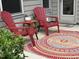 Serene patio featuring comfortable seating and a decorative rug, creating an inviting outdoor retreat at 1008 Sounding Ln, Durham, NC 27703