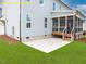 Backyard of a home featuring green grass, a patio, a covered porch, and light grey siding at 1036 Smoke Willow Way, Rolesville, NC 27571