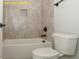 Modern bathroom featuring a bathtub and toilet at 1036 Smoke Willow Way, Rolesville, NC 27571