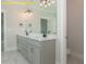 Beautiful bathroom featuring double marble vanity, sleek fixtures, tiled flooring and lots of light at 1036 Smoke Willow Way, Rolesville, NC 27571