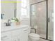 Bright bathroom with a shower and vanity at 1036 Smoke Willow Way, Rolesville, NC 27571