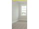 A bedroom featuring a large window at 1036 Smoke Willow Way, Rolesville, NC 27571