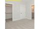 Bedroom featuring neutral carpet, a walk-in closet, a passage to the bathroom, and classic white trim at 1036 Smoke Willow Way, Rolesville, NC 27571